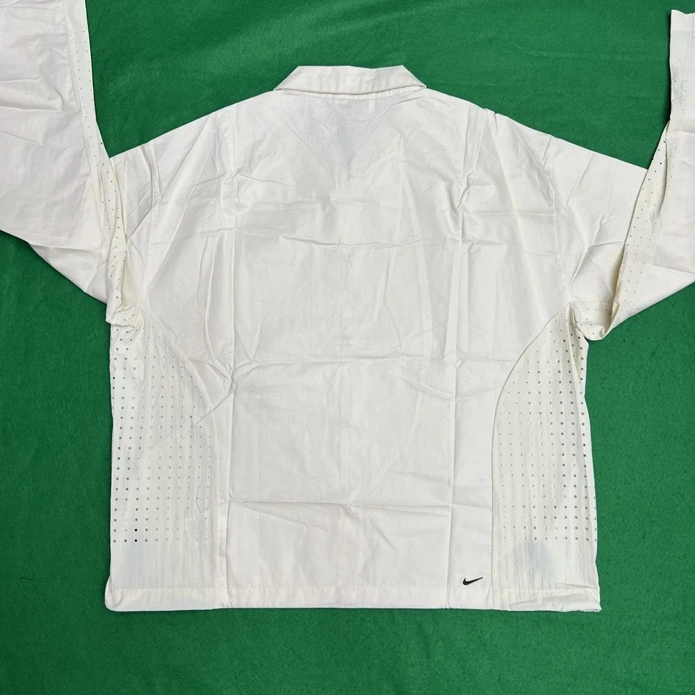 Nike tech button